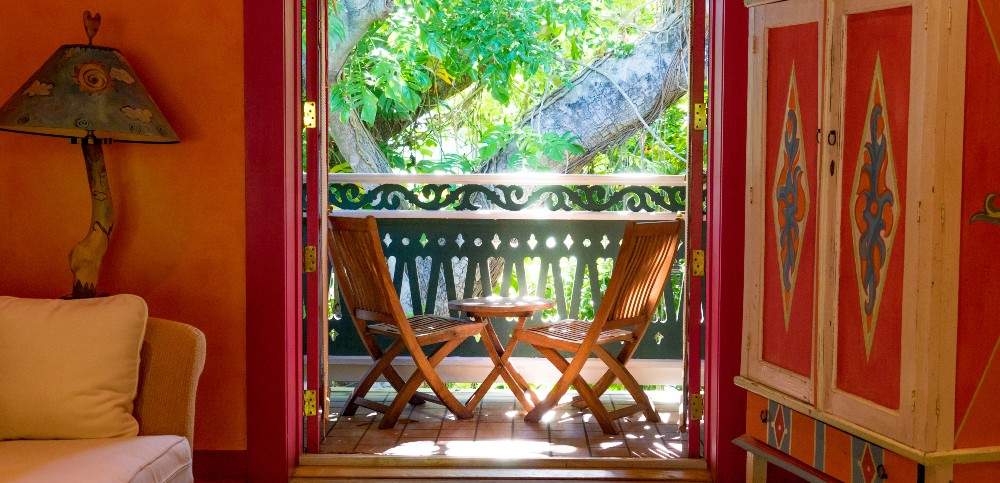 Orange motif with view of table and chairs on patio